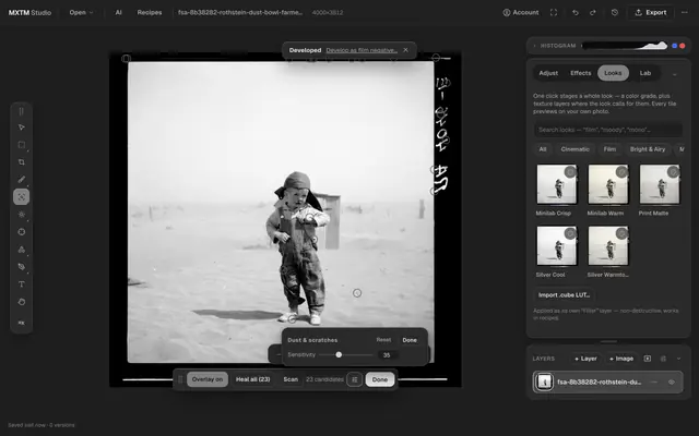 The MXTM Studio editor with the dust map switched on over a film scan: small markers sit on the detected dust and scratch candidates, next to the sensitivity slider, the candidate count and the “Heal all” button.